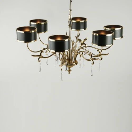 The VICTORIA CHANDELIER features six curved gold arms, each with a black and gold cylindrical shade and crystal pendants, all set against a plain white background.